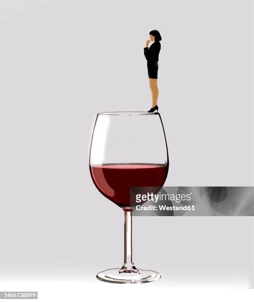 illustration of woman standing on rim of large wineglass - conclusion stock illustrations