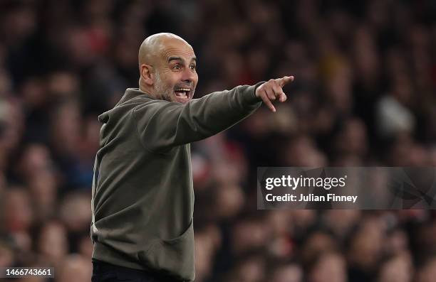 Pep Guardiola, Manager of Manchester City, reacts during the Premier League match between Arsenal FC and Manchester City at Emirates Stadium on...