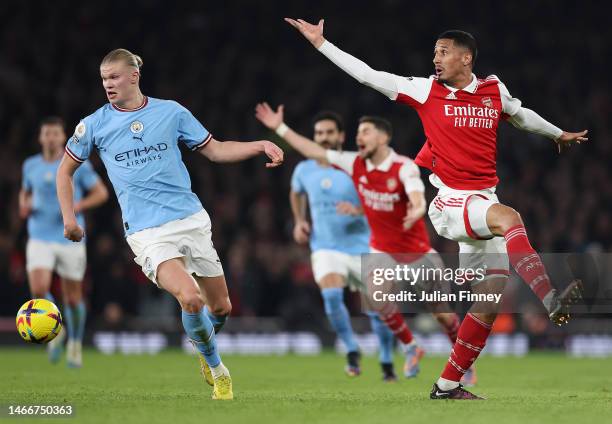 Erling Haaland of Manchester City moves away from William Saliba of Arsenal during the Premier League match between Arsenal FC and Manchester City at...