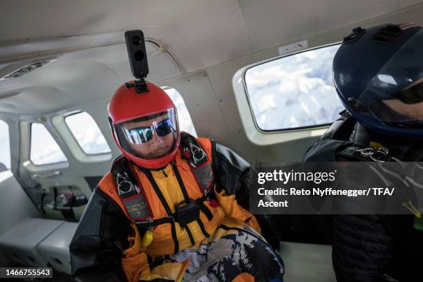 portrait of wingsuit flier in airplane - indoor skydive stockfoto's en -beelden