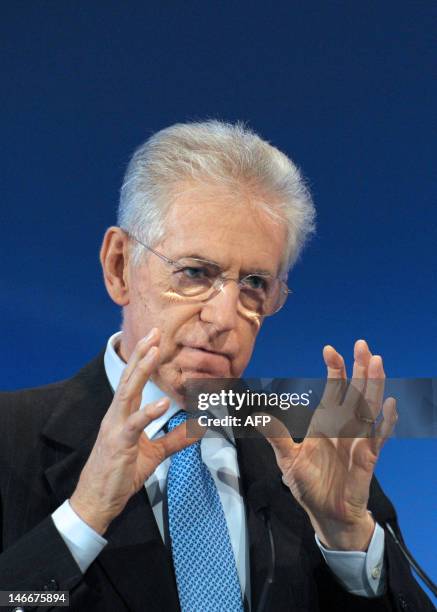 Italian Prime Minister Mario Monti gives a speech to close the 4th edition of the "Colloque Nouveau Monde" at the Economy Ministry in Paris on...