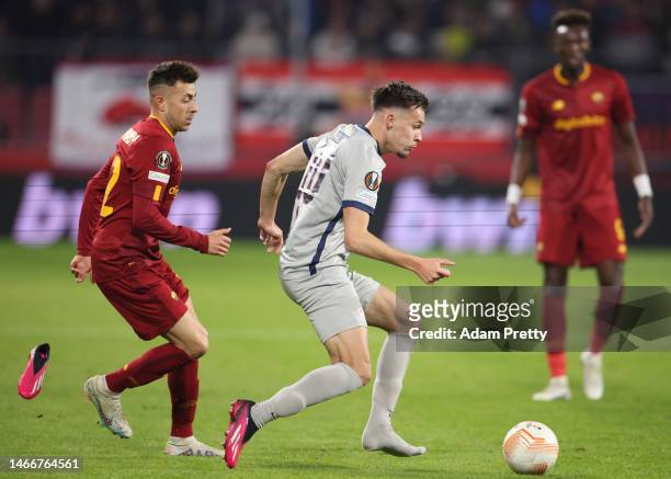 Amar Dedic of FC Salzburg loses a boot as they are challenged by Stephan El Shaarawy of AS Roma during the UEFA Europa League knockout round play-off...