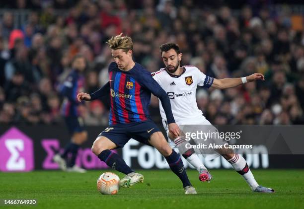 Frenkie de Jong of FC Barcelona is challenged by Bruno Fernandes of Manchester United during the UEFA Europa League knockout round play-off leg one...