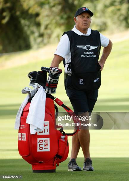 Steve Williams, caddie for Patrick Cantlay of the United States, looks on from the 18th hole during the first round of the The Genesis Invitational...