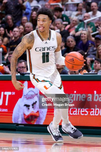 Jordan Miller of the Miami Hurricanes in action against the Louisville Cardinals during the second half at Watsco Center on February 11, 2023 in...