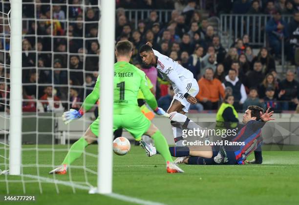 Marcus Rashford of Manchester United scores the team's first goal past Marc-Andre ter Stegen of FC Barcelona during the UEFA Europa League knockout...