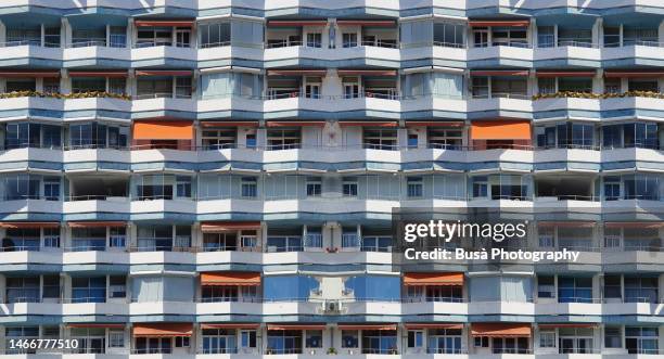 vacation apartment building in tenerife (composit image) - canarino delle isole canarie foto e immagini stock