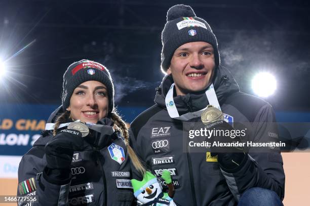 Bronze medalists Tommaso Giacomel of Italy and Lisa Vittozzi of Italy pose for a photo during the medal ceremony for the Single Mixed Relay at the...