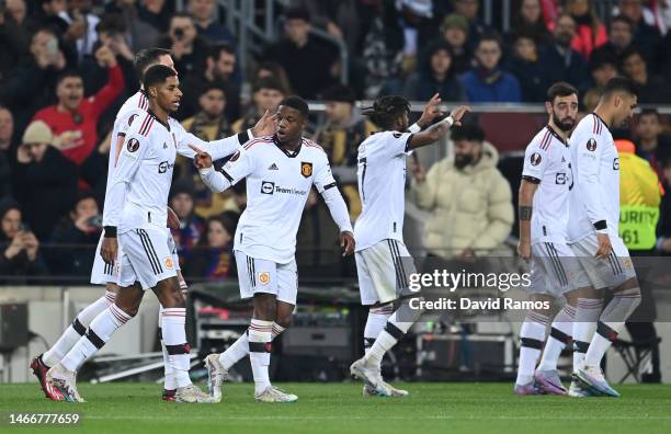 Marcus Rashford of Manchester United celebrates with teammates after scoring the team's first goal during the UEFA Europa League knockout round...