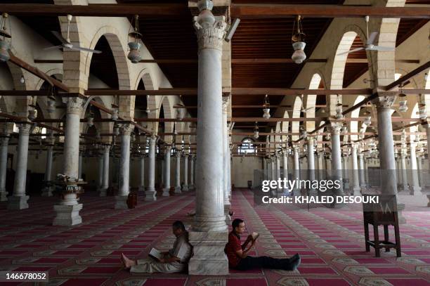 Egyptians read from the Koran, Islam's holy book, in the historical mosque of Amr Ibn al-Aas in Cairo on June 22, 2012. AFP PHOTO / KHALED DESOUKI