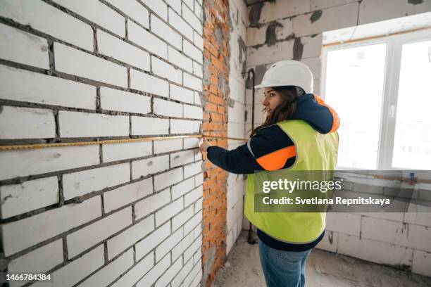 Builders Using Measure 8,341 Bricks Builder Stock Photos, High-Res Pictures, and Images ...