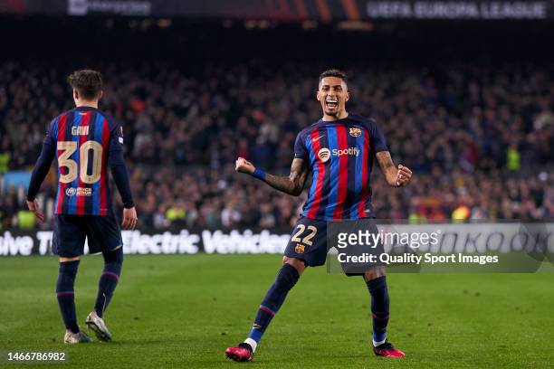 Raphinha of FC Barcelona celebrates after scoring his team's second goal during the UEFA Europa League knockout round play-off leg one match between...