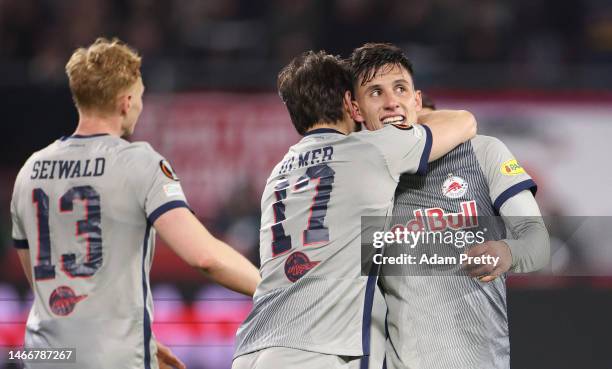 Nicolas Capaldo of FC Salzburg celebrates with teammates after scoring the team's first goal during the UEFA Europa League knockout round play-off...