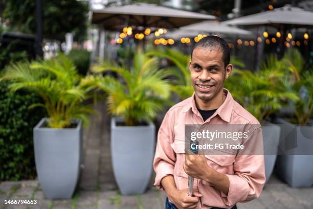 portrait of a visually impaired man in the street - blind persons cane stock pictures, royalty-free photos & images