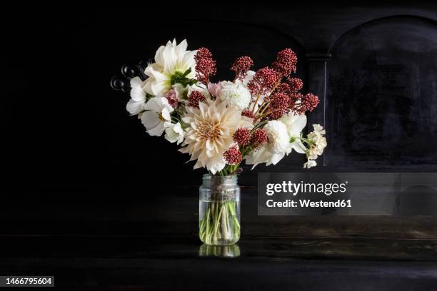 arrangement of blooming seasonal flowers on piano - arrangements of flowers stock pictures, royalty-free photos & images