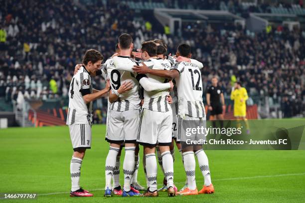 Dusan Vlahovic of Juventus celebrates with teammates after scoring his team's first goal during the UEFA Europa League knockout round play-off leg...