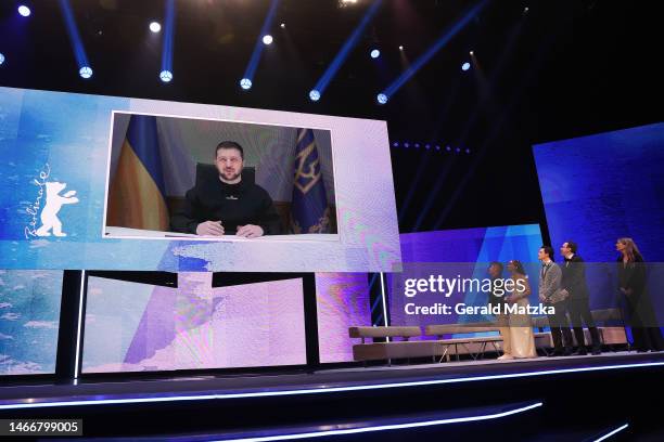 Ukraine's President Volodymyr Zelenskiy addresses the audience on a TV screen during the Opening Ceremony of the 73rd Berlinale International Film...