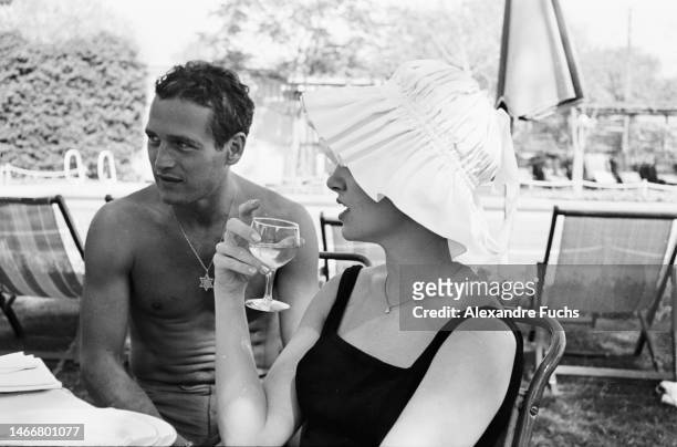 Actor Paul Newman with wife, actress Joanne Woodward, relaxing by the pool in 1959, at Jerusalem, Israel.