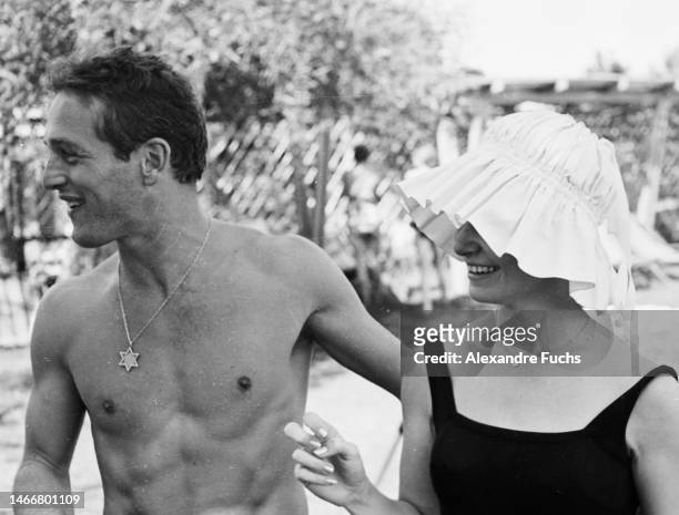Actor Paul Newman with wife, actress Joanne Woodward, relaxing by the pool in 1959, at Jerusalem, Israel.