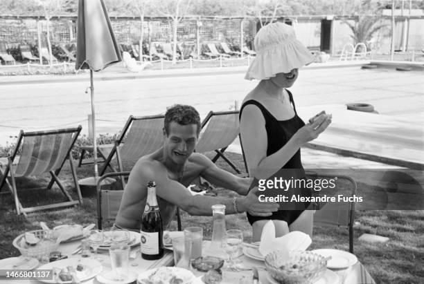 Actor Paul Newman goofing with wife, actress Joanne Woodward, at Jerusalem, Israel, in 1959.
