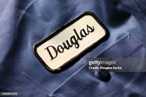 service worker name on a uniform shirt - shirt tag stock pictures, royalty-free photos & images