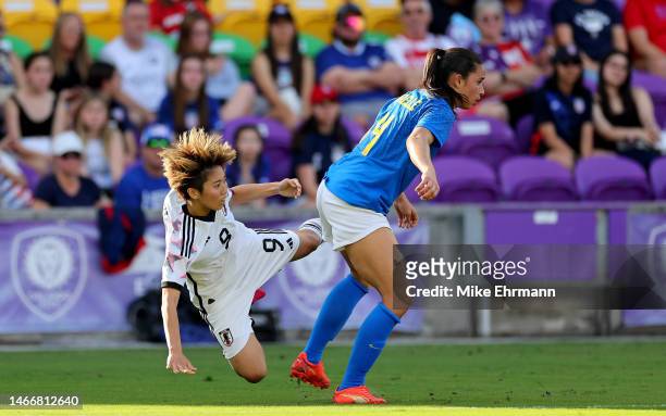 Riko Ueki of Japan fight for the ball with Rafaelle of Brazil during the She Believes Cup at Exploria Stadium on February 16, 2023 in Orlando,...