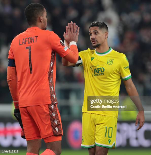 Ludovic Blas of FC Nantes celebrates with his teammate Alban Lafont at the end of the UEFA Europa League knockout round play-off leg one match...