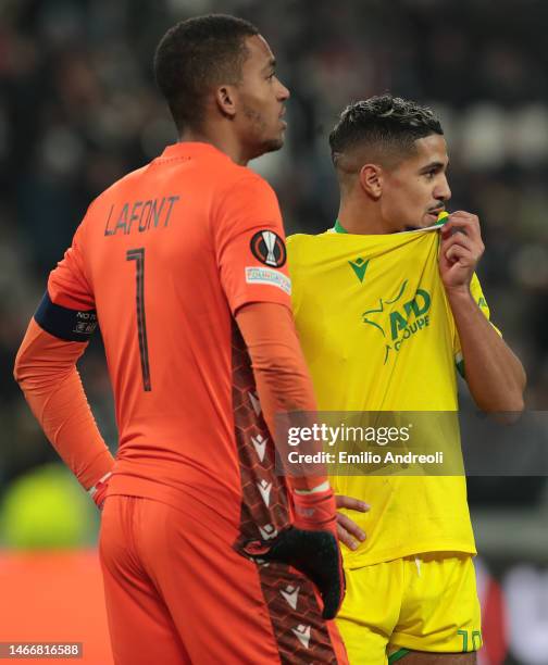 Ludovic Blas of FC Nantes and his teammate Alban Lafont look on at the end of the UEFA Europa League knockout round play-off leg one match between...