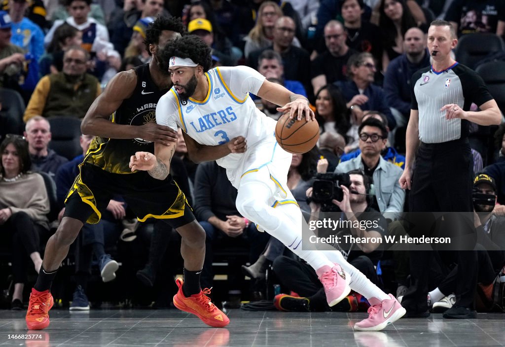 Anthony Davis Of The Los Angeles Lakers Dribbling The Ball Defended anthony-davis-of-the-los-angeles-lakers-dribbling-the-ball-defended