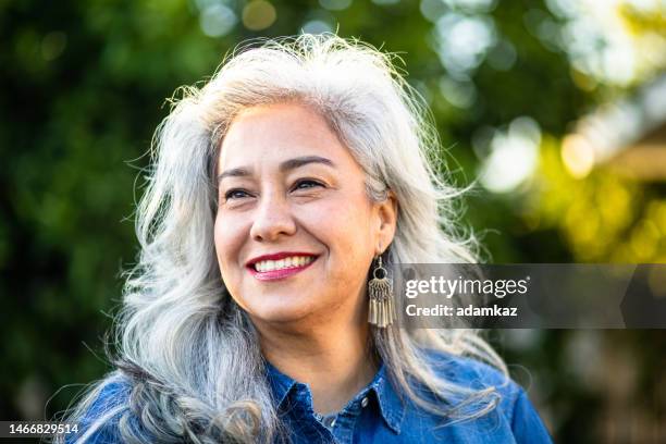 portrait of a beautiful senior mexican woman - active lifestyle overweight stock pictures, royalty-free photos & images