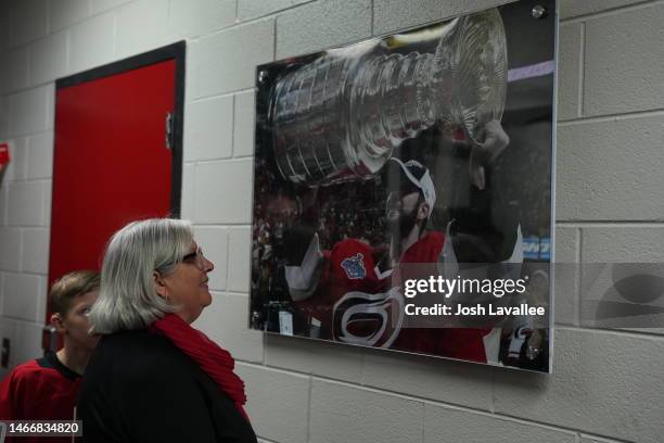 Laurel Ward, mother of Cam Ward, looks at a photo of her son holding the Stanley Cup prior to his Carolina Hurricanes hall of fame induction ceremony...