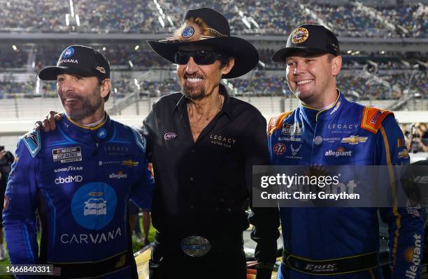 Legacy Motor Club team owners, Jimmie Johnson, driver of the Carvana Chevrolet, and NASCAR Hall of Famer Richard Petty pose for photos with Erik...