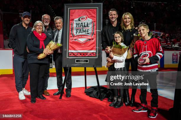 Cam Ward poses with his family alongside Carolina Hurricanes general manager Don Waddell and owner/governor Tom Dundon after his induction into the...