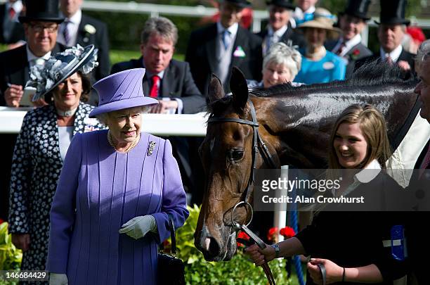 Queen Elizabeth II with her horse Estimate after winning the Queen's Vase during Royal Ascot at Ascot racecourse on June 22, 2012 in Ascot, England.