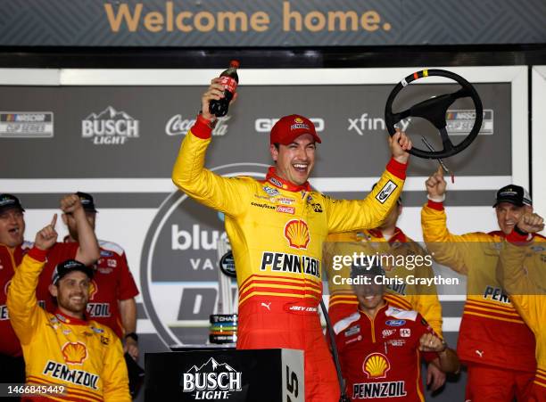 Joey Logano, driver of the Shell Pennzoil Ford, celebrates in victory lane after winning the NASCAR Cup Series Bluegreen Vacations Duel at Daytona...