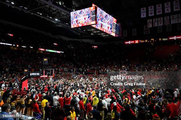 The Maryland Terrapins fans storm the court after a 68-54 victory against the Purdue Boilermakers at Xfinity Center on February 16, 2023 in College...