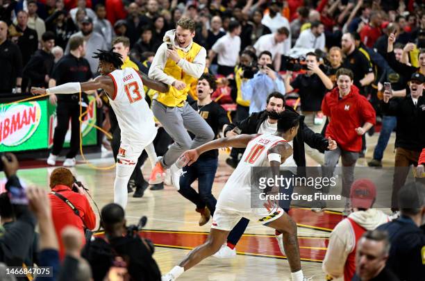 Hakim Hart and Julian Reese of the Maryland Terrapins celebrate with fans after a 68-54 victory against the Purdue Boilermakers at Xfinity Center on...