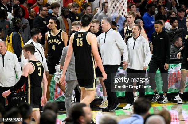 Head coach Matt Painter of the Purdue Boilermakers leads his team off before the fans storm the court after a 68-54 Maryland Terrapins victory at...