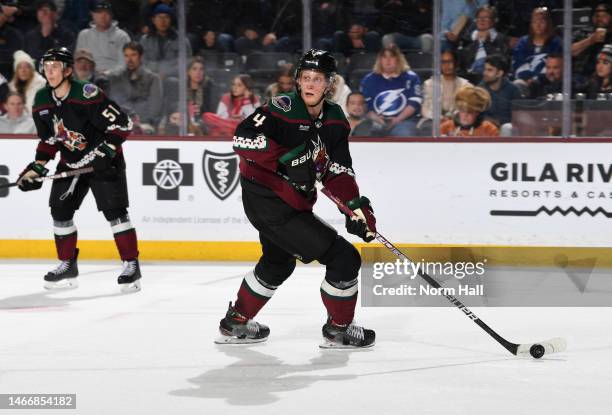 Juuso Valimaki of the Arizona Coyotes skates with the puck against the Tampa Bay Lightning at Mullett Arena on February 15, 2023 in Tempe, Arizona.