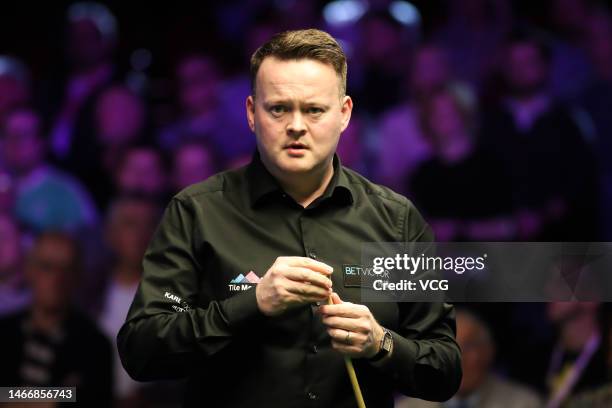 Shaun Murphy of England chalks the cue in the fourth round match against Daniel Wells of Wales on day four of 2023 Betvictor Welsh Open at Venue...