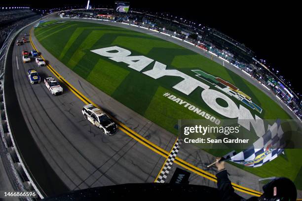 Aric Almirola, driver of the Smithfield Ford, takes the checkered flag to win the NASCAR Cup Series Bluegreen Vacations Duel at Daytona International...