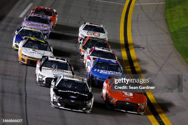 Aric Almirola, driver of the Smithfield Ford, and Todd Gilliland, driver of the gener8tor Skills Ford, ll during the NASCAR Cup Series Bluegreen...