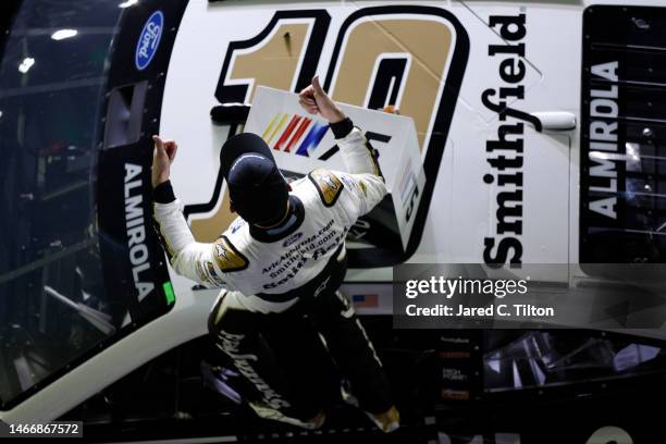 Aric Almirola, driver of the Smithfield Ford, celebrates after winning the NASCAR Cup Series Bluegreen Vacations Duel at Daytona International...