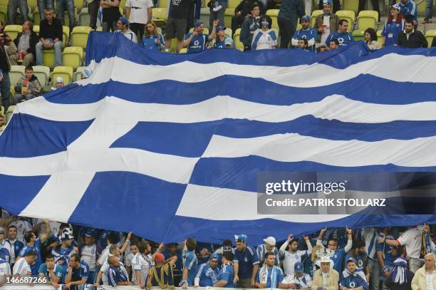 Giant flag of Greece's national football team is displayed in the grandstand ahead of the Euro 2012 football championships quarter-final match...