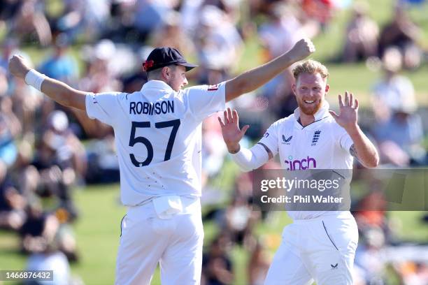 Ben Stokes of England celebrates his wicked of Devon Conway of New Zealand with Ollie Robinson during day two of the First Test match in the series...