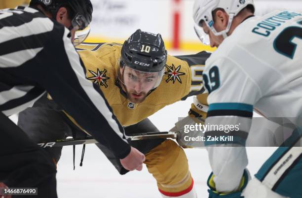 Nicolas Roy of the Vegas Golden Knights faces off with Logan Couture of the San Jose Sharks during the first period at T-Mobile Arena on February 16,...