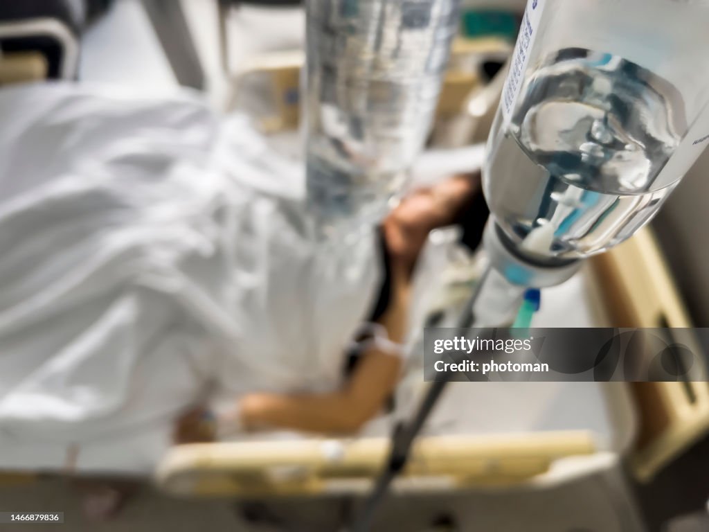 IV drip with serum on hospital background, top view