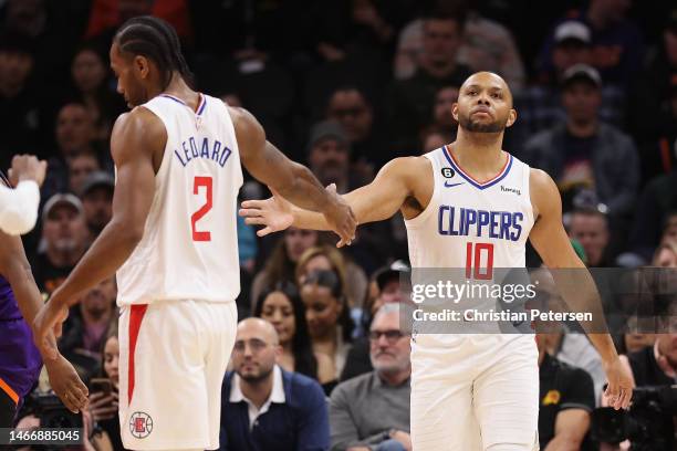 Eric Gordon of the LA Clippers high fives Kawhi Leonard after scoring against the Phoenix Suns during the first half of the NBA game at Footprint...