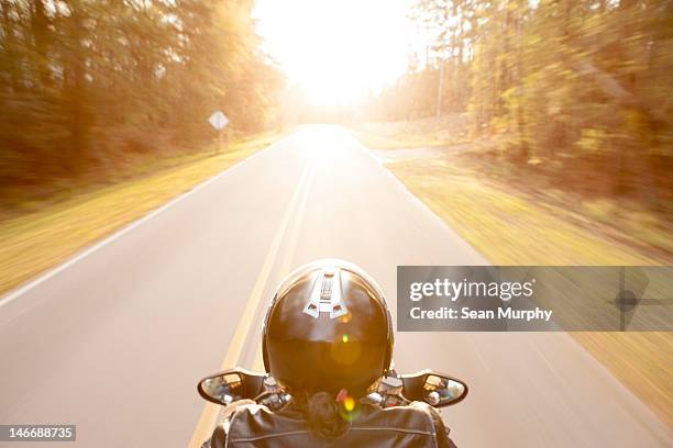 motorcyclist's perspective of the open road - crash helmet fotografías e imágenes de stock