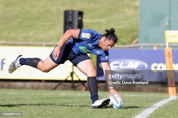 Caleb Clarke of the Blues scores a try during the Super Rugby Pacific Trial match between the Chiefs and the Blues at Navigation Homes Stadium on...
